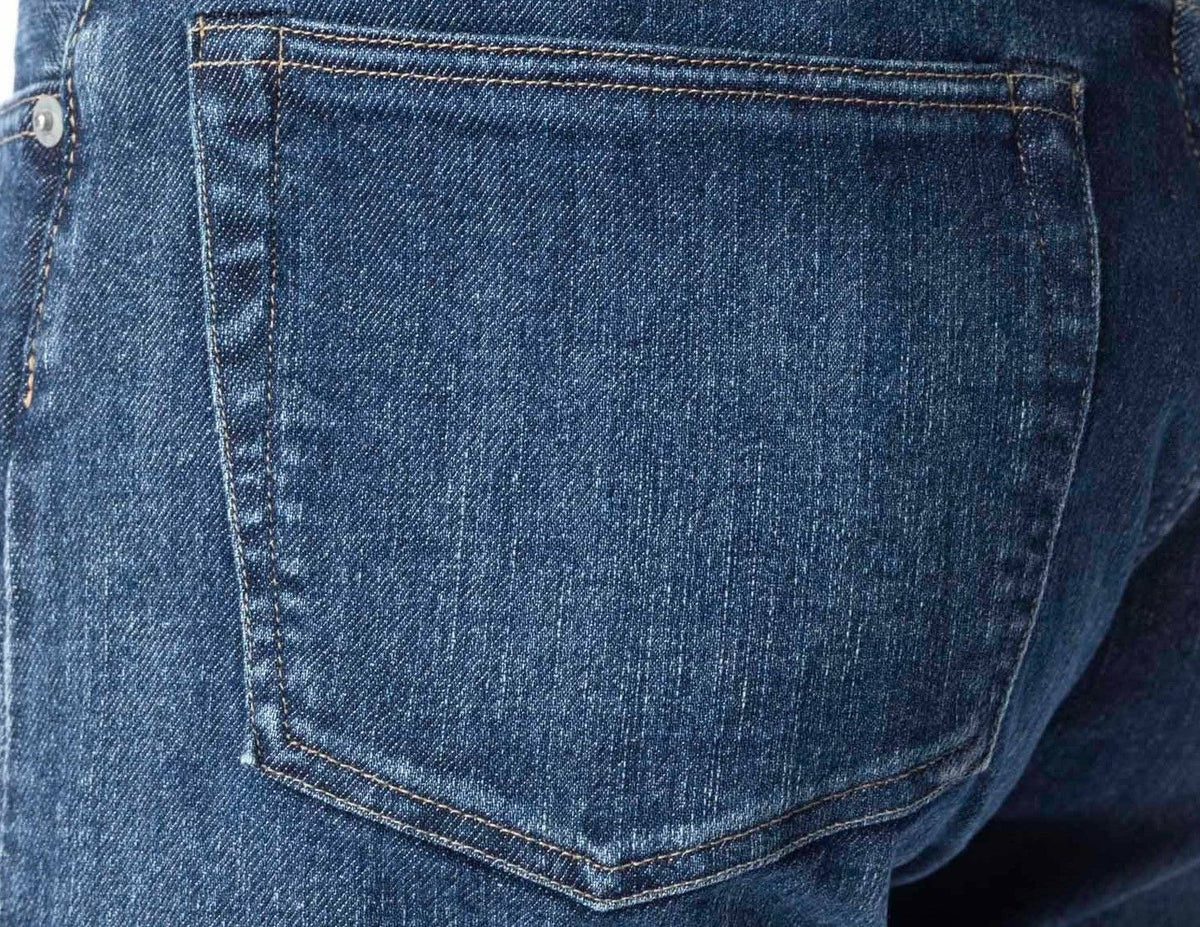 A close view of the back pocket of stretch denim, the twill shading no different from 100% cotton denim