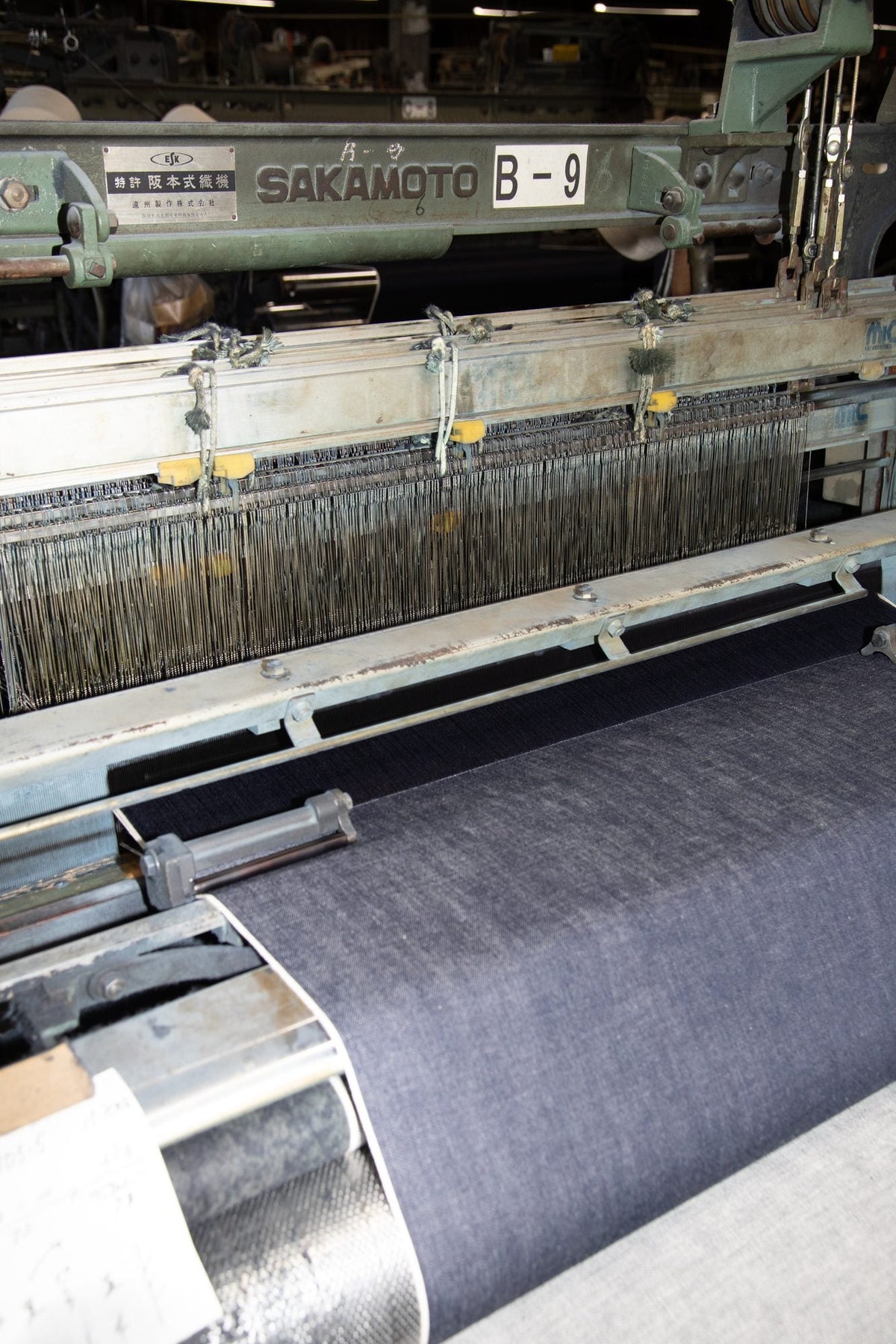 Denim fabric being wound from the loom
