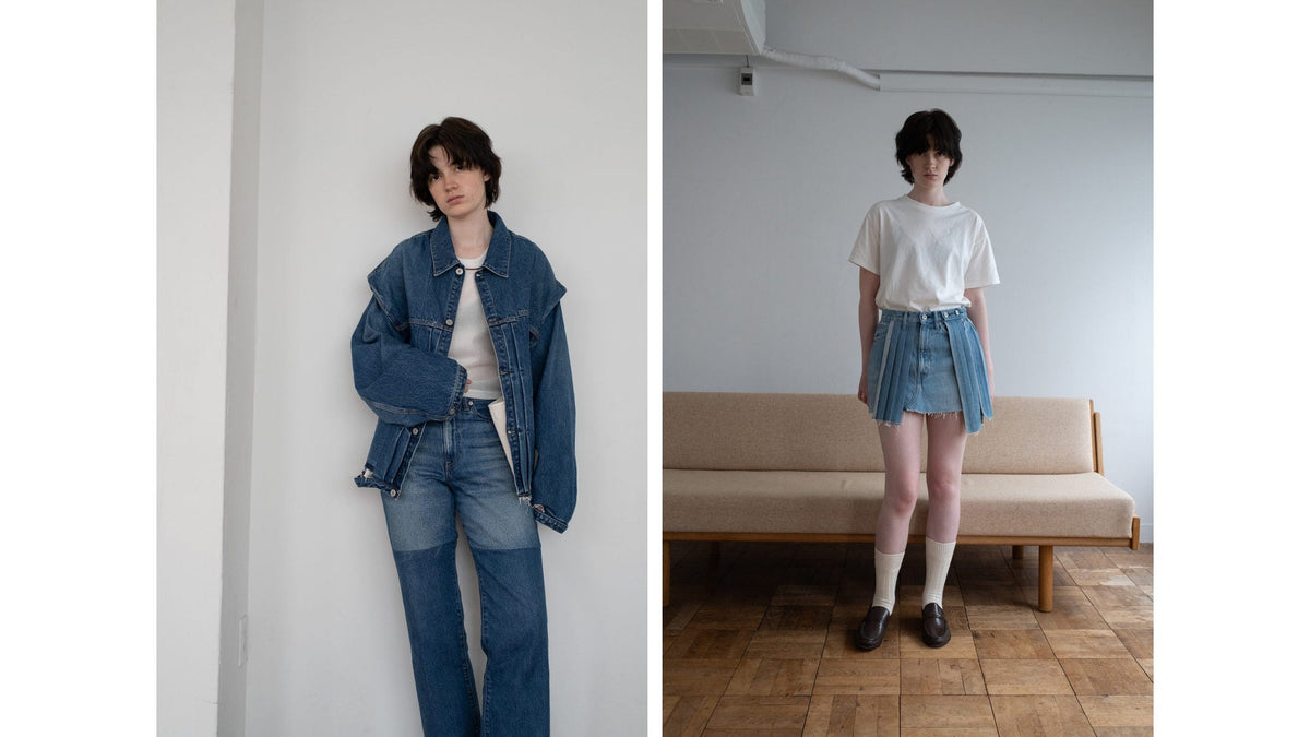 An oversized denim jacket with two-tone denim, and a white tee with a pleated denim mini skirt, shot indoors.